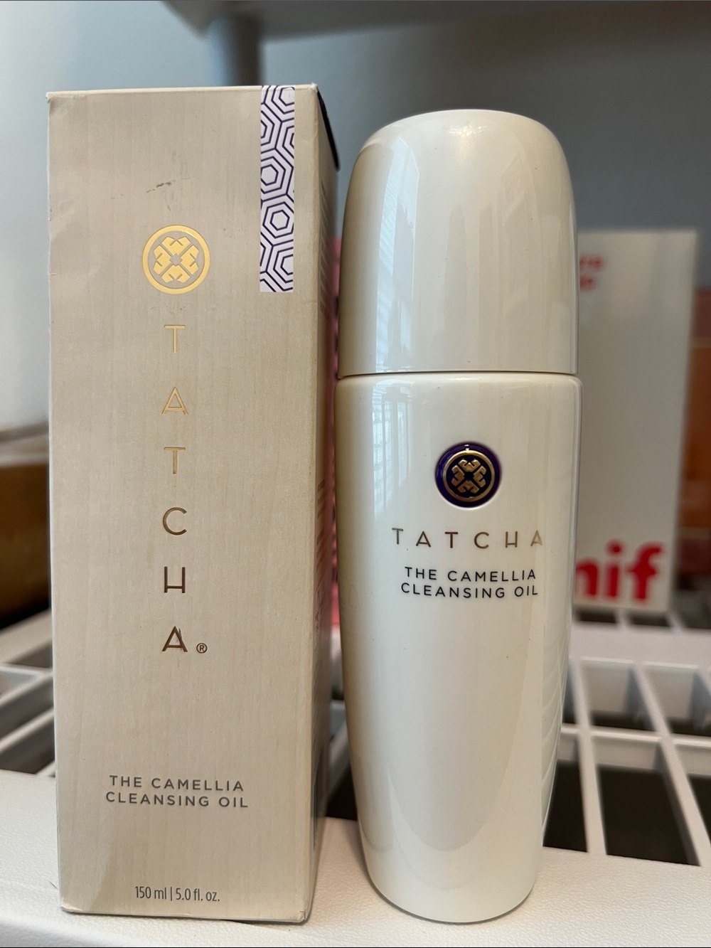 Tatcha Camellia Cleansing Oil Bottle in White with Gold Accents